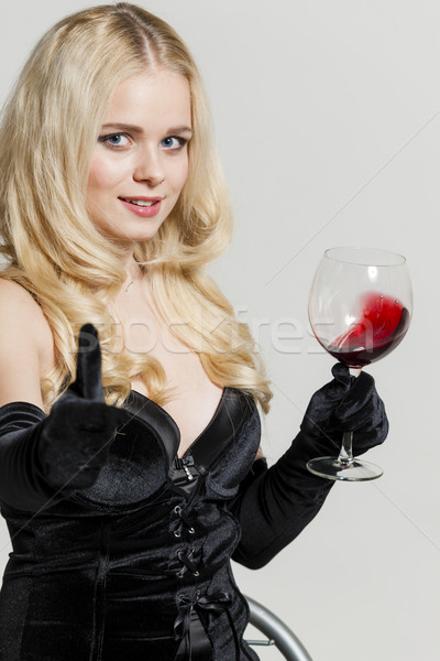 portrait of young woman with a glass of red wine Stock photo © phbcz