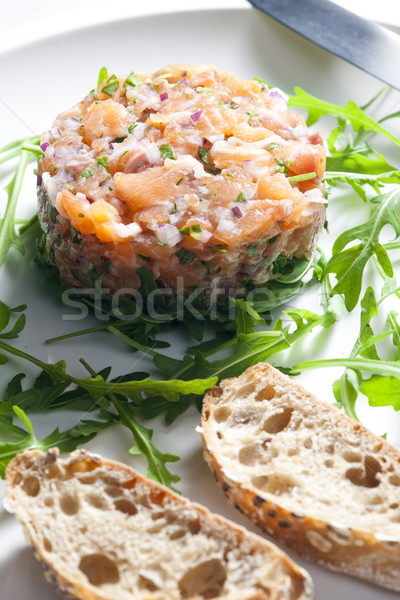 salmon tartare with ruccola Stock photo © phbcz