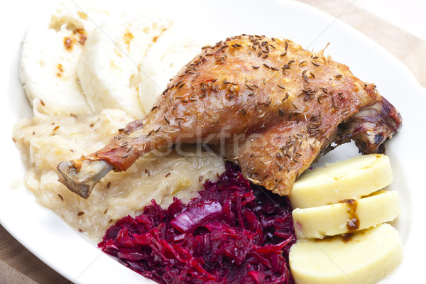 baked duck meat with dumlings and cabbage Stock photo © phbcz