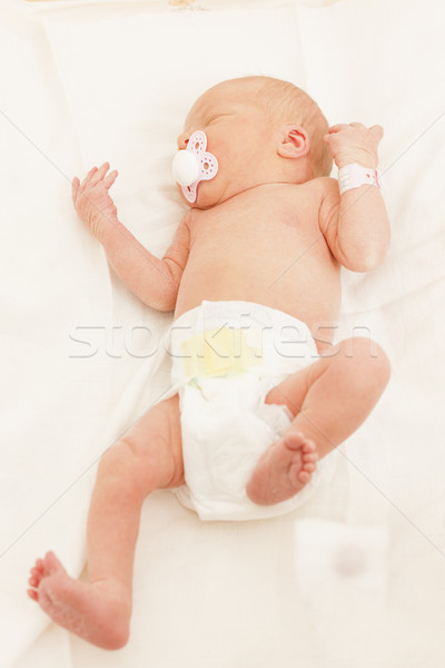 lying newborn baby girl Stock photo © phbcz