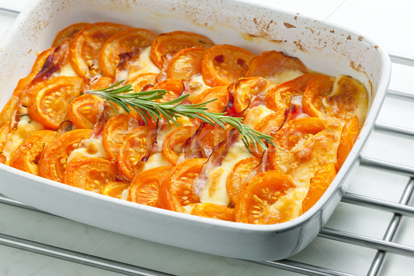 tomatoes baked with mozzarella cheese and pancetta Stock photo © phbcz