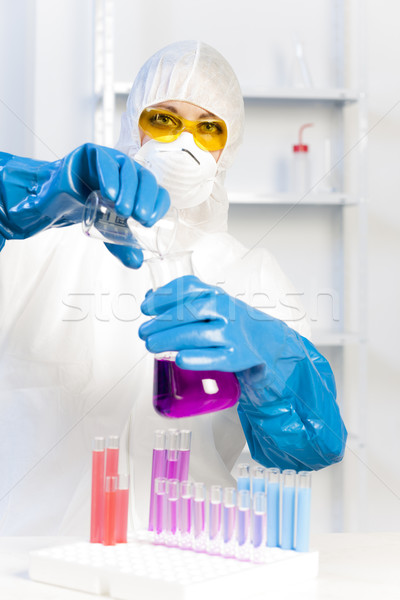 young woman wearing protective coat in laboratory Stock photo © phbcz