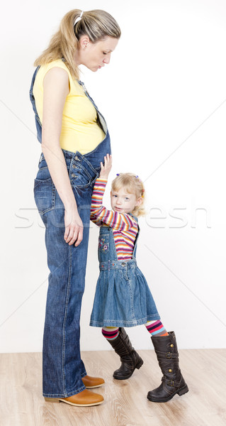 Fetita gravidă mamă femei copil blugi Imagine de stoc © phbcz