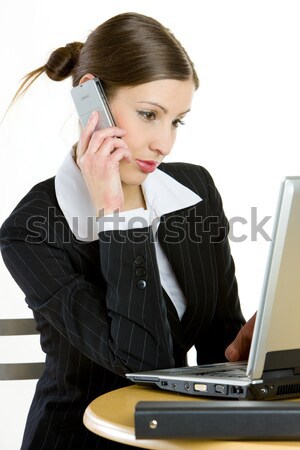 telephoning businesswoman with a laptop Stock photo © phbcz