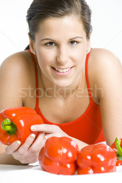 portrait of lying down woman with peppers Stock photo © phbcz