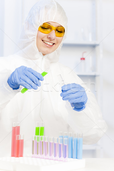 young woman wearing protective coat in laboratory Stock photo © phbcz