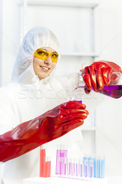 young woman wearing protective coat in laboratory Stock photo © phbcz