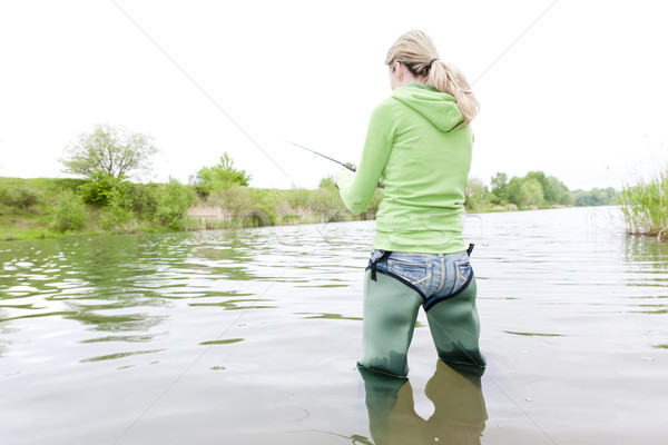 woman fishing in pond Stock photo © phbcz