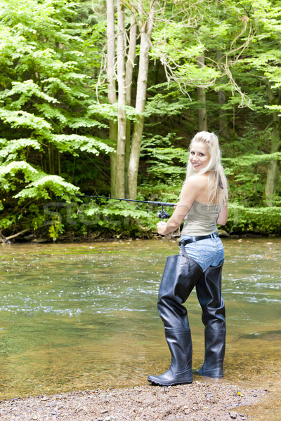 Kadın balık tutma nehir dinlenmek kadın ayakta Stok fotoğraf © phbcz