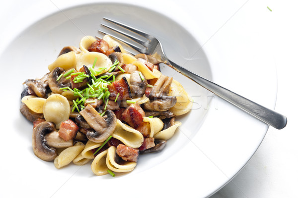 pasta orecchiette with fried champignons and bacon Stock photo © phbcz