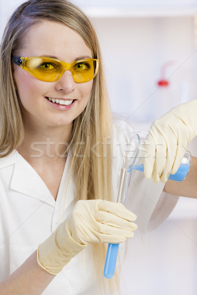 portrait of young woman doing experiment in laboratory Stock photo © phbcz