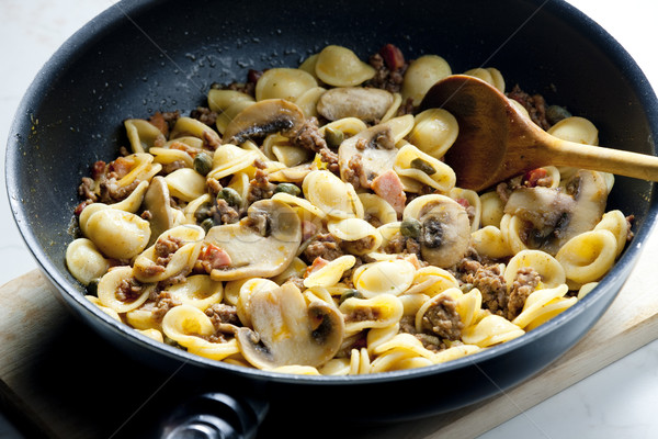 pasta orecchiette with bacon and champignons Stock photo © phbcz