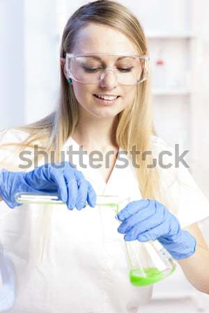 young woman doing experiment in laboratory Stock photo © phbcz