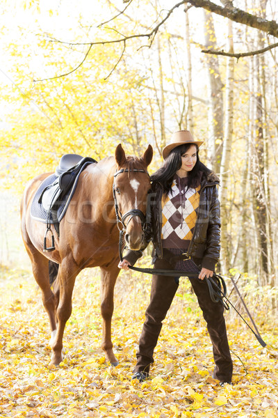 equestrian with her horse in autumnal nature Stock photo © phbcz