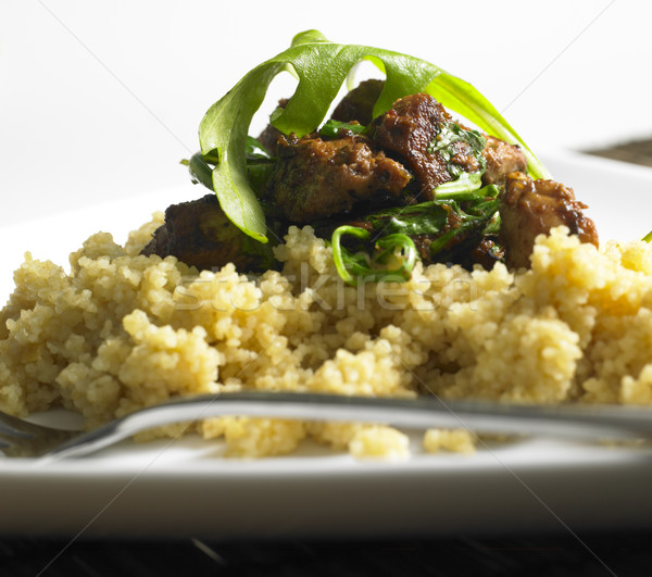 chicken meat with rucola on couscous Stock photo © phbcz