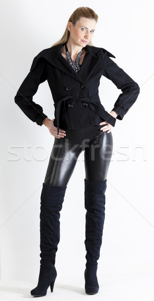 Stock photo: standing woman wearing black clothes and black boots