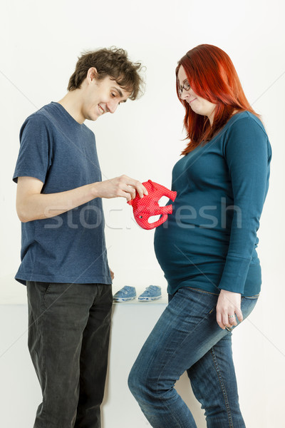 portrait of pregnant woman and her husband with a toy for a baby Stock photo © phbcz