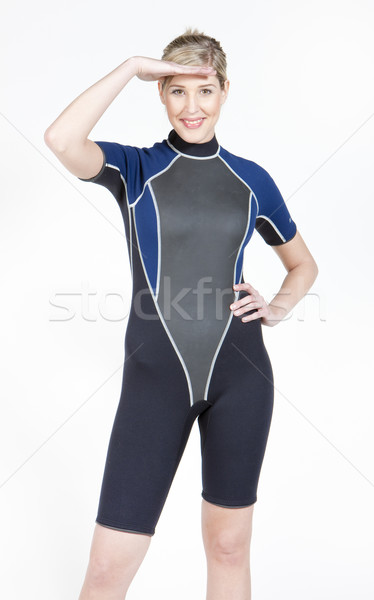 standing young woman wearing neoprene Stock photo © phbcz