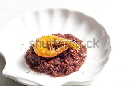 fried prawn on risotto steamed with red wine Stock photo © phbcz
