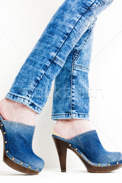 Stock photo: detail of woman wearing denim clogs