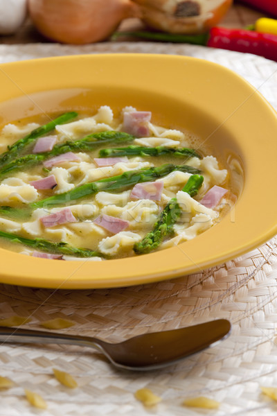 vegetable bouillon soup with asparagus and ham Stock photo © phbcz