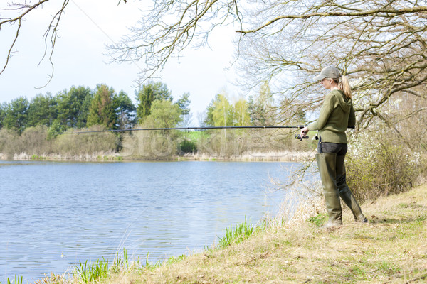 Stock photo: woman fishing at pond in spring