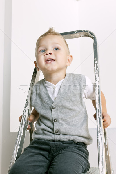portrait of little boy sitting on stepladder Stock photo © phbcz