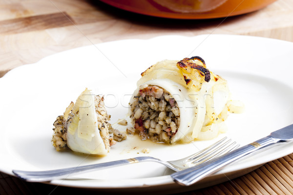 sepia filled with pearl barley baked with onion Stock photo © phbcz