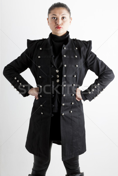 portrait of standing young woman wearing extravagant clothes Stock photo © phbcz