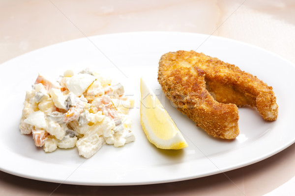 Sült ponty burgonyasaláta tányér krumpli étel Stock fotó © phbcz
