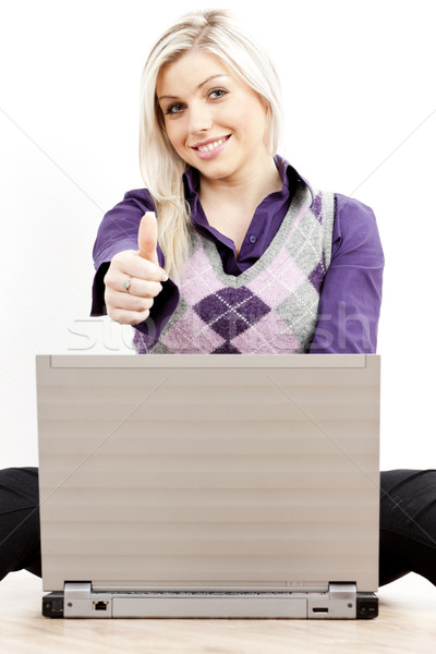 sitting young businesswoman with a notebook Stock photo © phbcz
