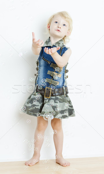 Stock photo: little girl with bubbles