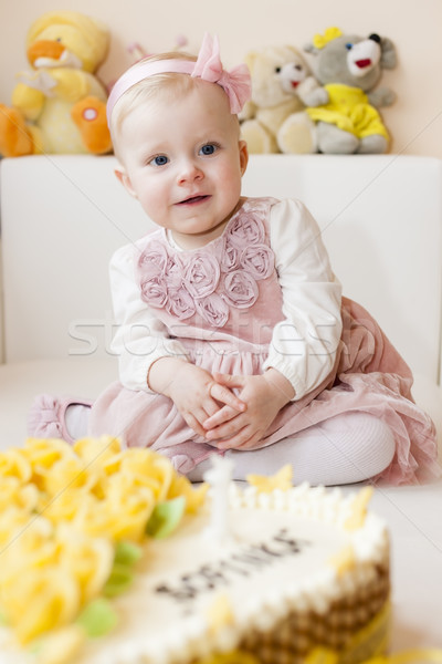 portrait of sitting toddler girl with her birthday cake Stock photo © phbcz