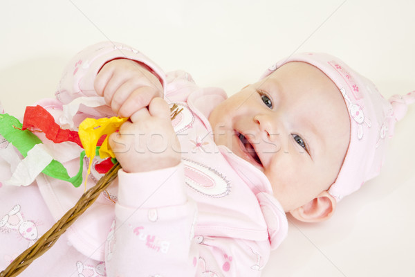 portrait of lying down baby girl holding a willow stick (Czech E Stock photo © phbcz