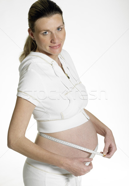pregnat woman with tape measure Stock photo © phbcz