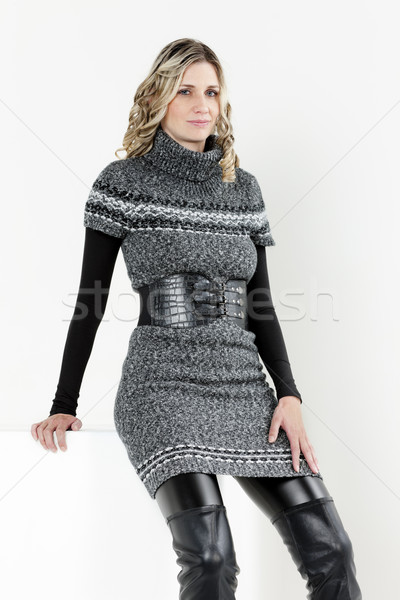 portrait of sitting woman wearing dress and black boots Stock photo © phbcz