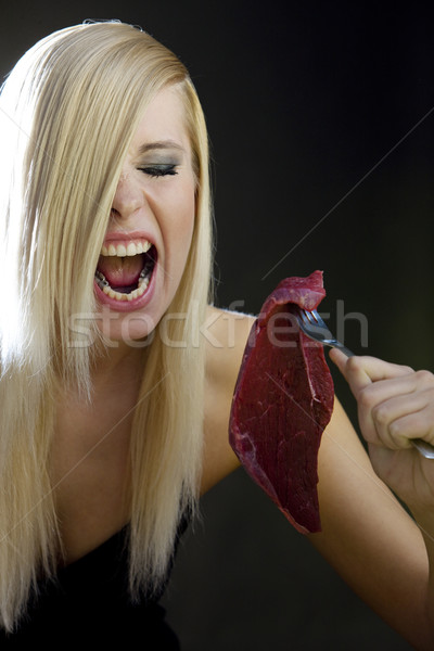 portrait of woman with raw meat Stock photo © phbcz