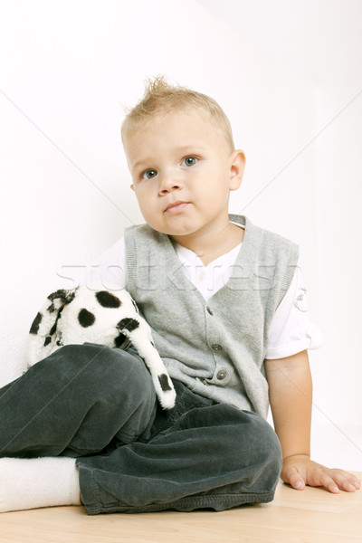 sitting toddler with a toy Stock photo © phbcz