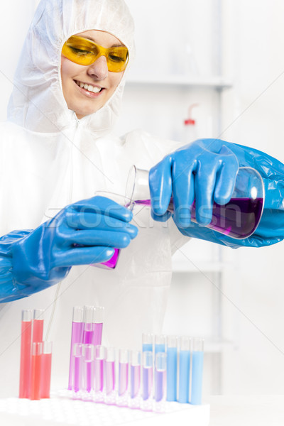 young woman wearing protective coat in laboratory Stock photo © phbcz