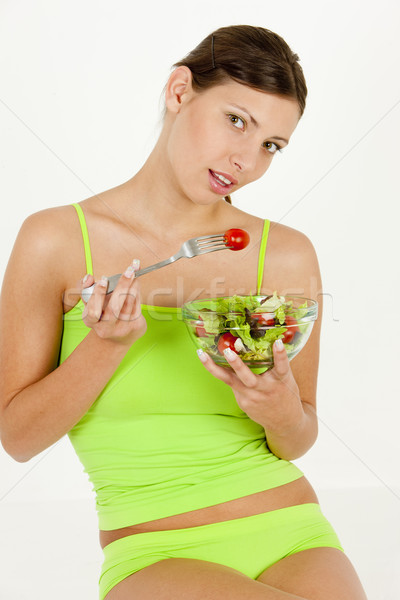 portrait of woman eating salad Stock photo © phbcz