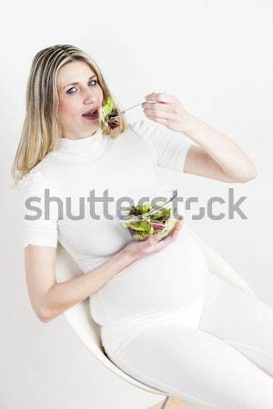 little girl caring after her pregnant mother Stock photo © phbcz