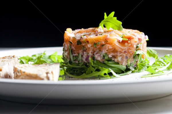 salmon tartare with ruccola Stock photo © phbcz