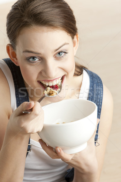 Stock photo: portrait of woman eating cereals