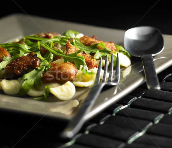 pasta orecchiette with meat noodles and rucola Stock photo © phbcz