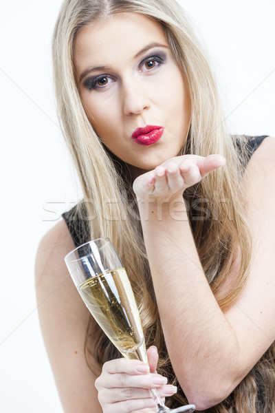 portrait of young woman with a glass of champagne Stock photo © phbcz