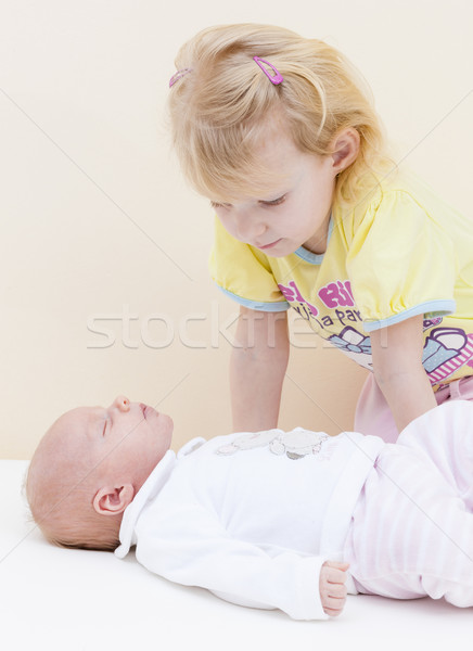 portrait of a little girl with her one month old baby sister Stock photo © phbcz