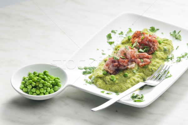 mashed peas with fried pancetta Stock photo © phbcz