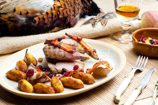 baked pheasant with bacon, pear, raisins on brandy Stock photo © phbcz