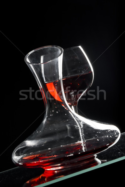 wine glass and carafe with red wine Stock photo © phbcz