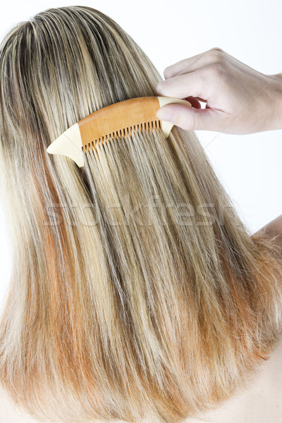 detail of woman combing long hair Stock photo © phbcz